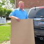 Marvatex sales rep holding a slip sheet